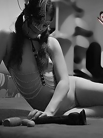 A stylish and sensual woman of a certain age is flirting with her spouse.