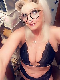 Half-naked explosive mature women posing.