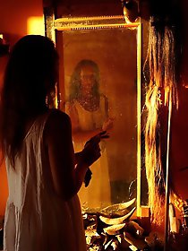 An amazing old lady is posing almost naked in stunning shots