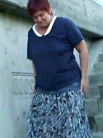 Awesome-looking old housewife is taking off her panties