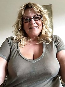 Experienced dame is taking off her underwear